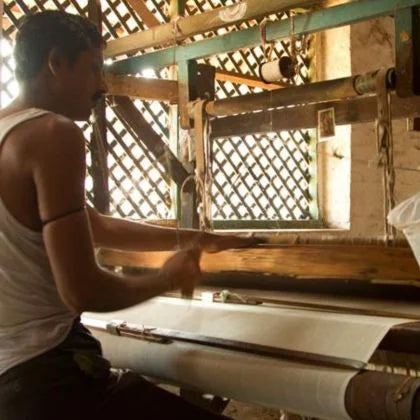 Engineer Monitoring First Batch Of Goods In Production Line