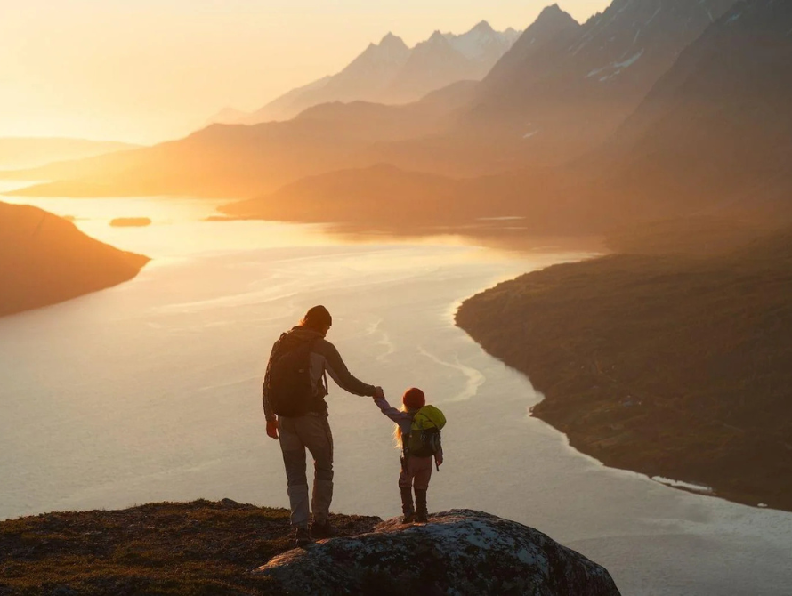 father-and-child-hiking-in-norway-traveling-together-summer-vacations